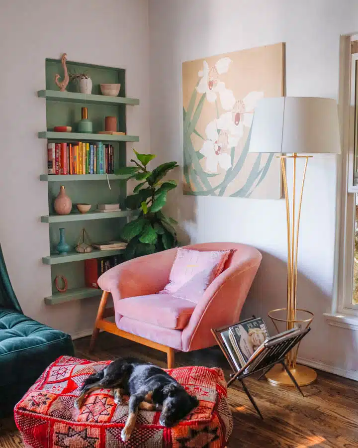 A living room filled with furniture and a dog on a bed