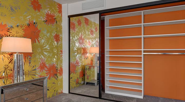 Front guest bedroom closet matches wallpaper
