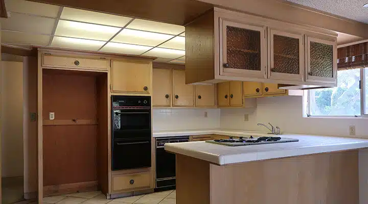 A kitchen with a stove top oven