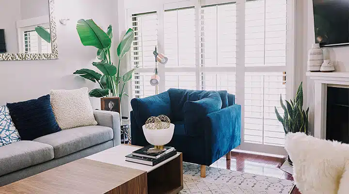 A living room filled with furniture and a large window