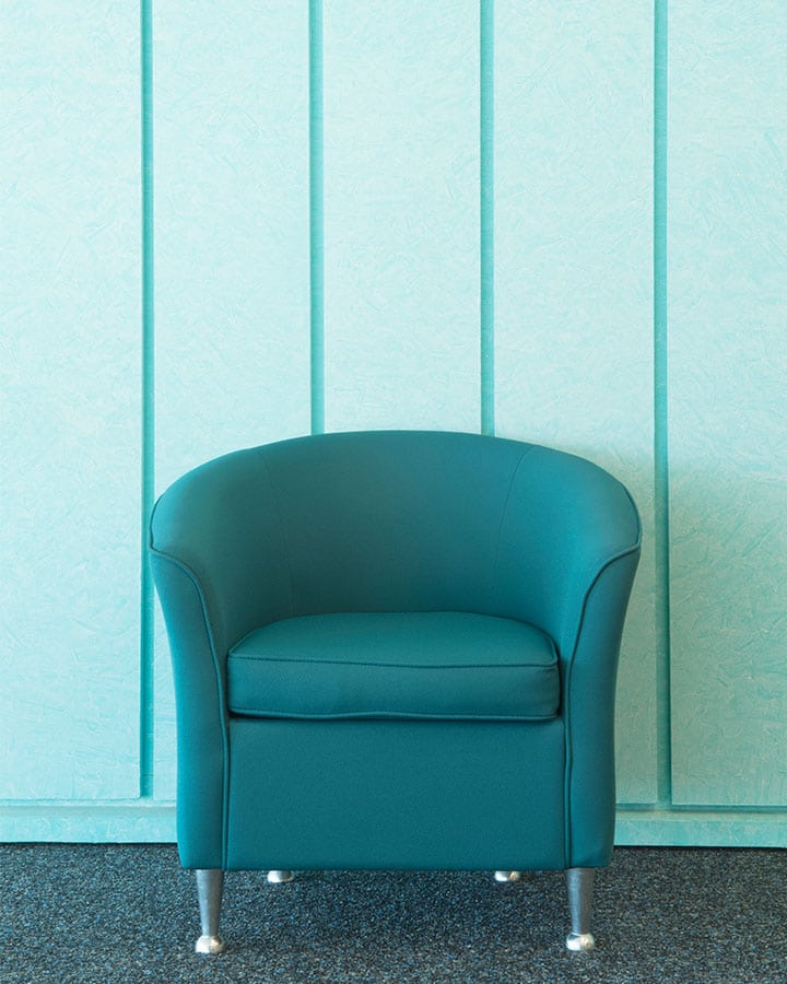 A blue seat sitting in a chair