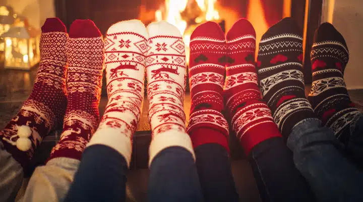 Holiday socks by fireplace