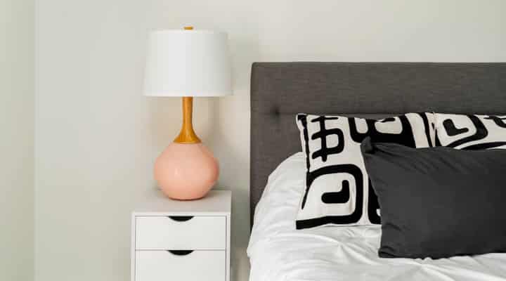 A lamp that is on a bed