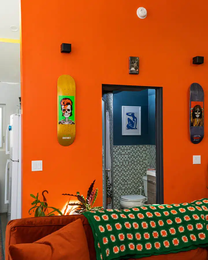 An orange room with an open door