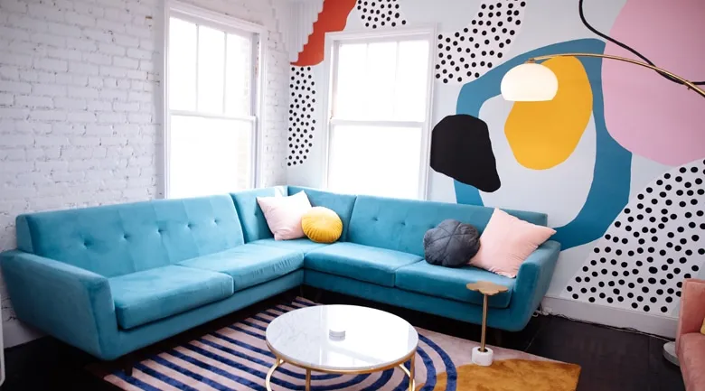 A living room with a blue chair