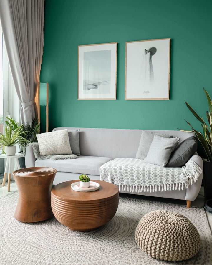 A living room with a green blanket