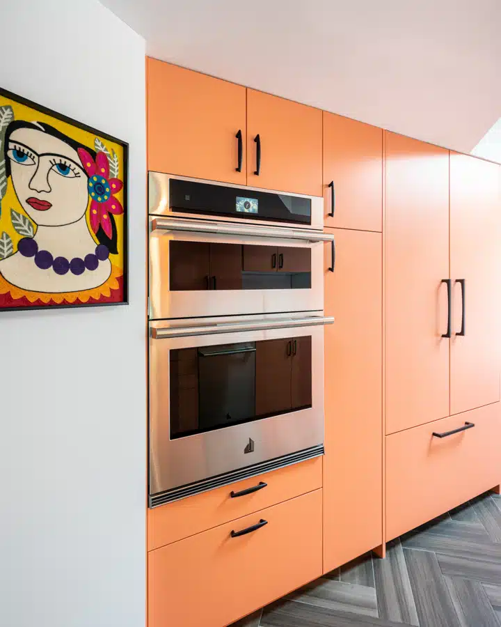 An orange refrigerator in a kitchen