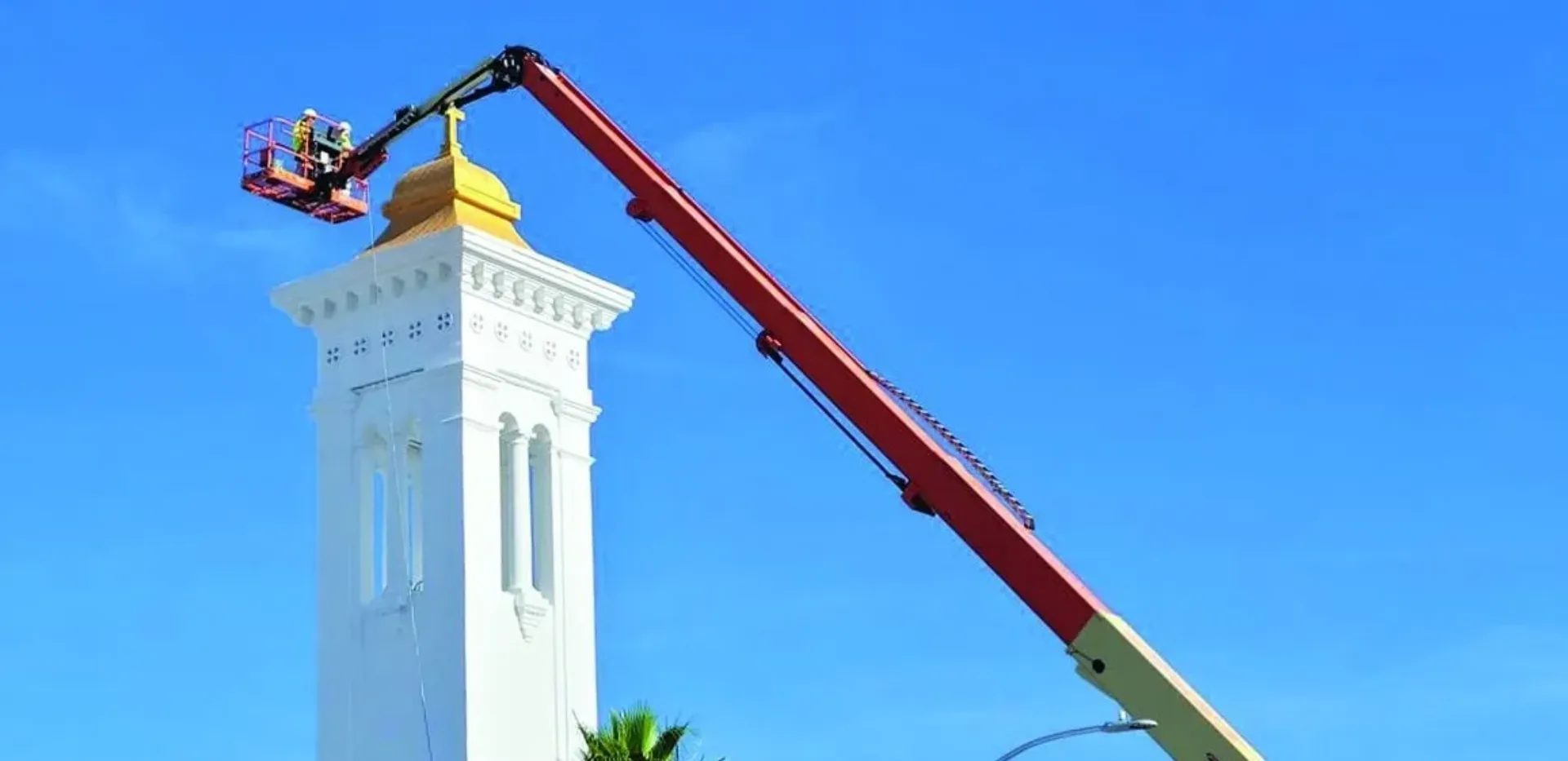A crane standing in front of a building