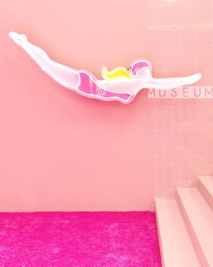 A close up of a pink wall