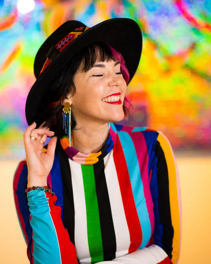 A person wearing a colorful phone